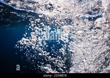 Underwater bubbles texture in transparent ocean. Air bubbles in tropical sea Stock Photo