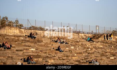 Nuremberg, Germany. 07th Nov, 2020. Excursionists sit in the evening sun at a distance from the Zeppelin grandstand on the former Nazi Party Rally grounds. A partial lockdown has been in effect in Germany since the beginning of the week. Credit: Daniel Karmann/dpa/Alamy Live News Stock Photo