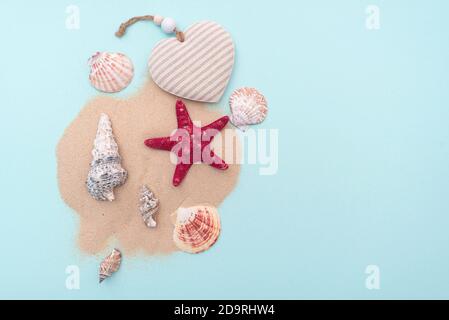 Holiday, summer vacation. Composition with sand and seashells, top view. Space for text. Layout for ideas. Stock Photo