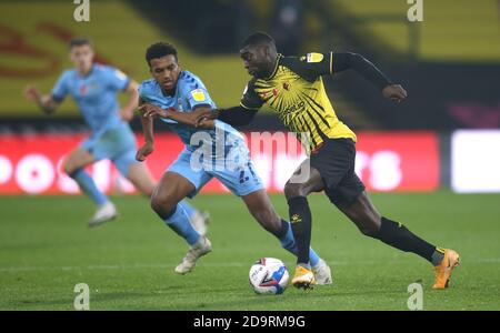Watford's Ken Sema (right) and Coventry City's Sam McCallum battle for the ball during the Sky Bet Championship match at Vicarage Road, Watford. Stock Photo