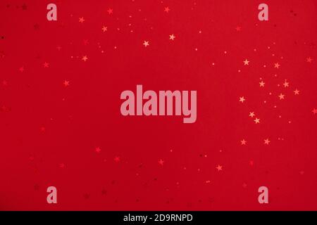 Shining stars on red background. Festive holiday background. Christmas. Wedding. Birthday. Happy woman's day. Mothers Day. Valentine's Day. Flat lay Stock Photo
