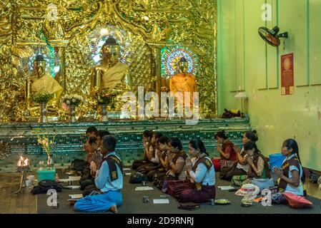 Worshipping God, Shwadagon Pagoda, Yangon, Myanmar Stock Photo