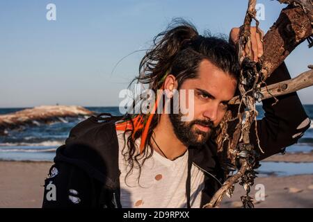 Young pirate boy portrait on the beach at sunset Stock Photo