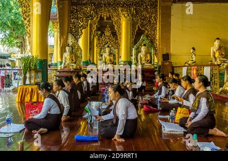 Worshipping God, Shwadagon Pagoda, Yangon, Myanmar Stock Photo