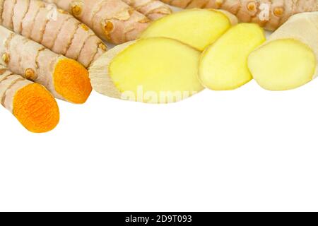 Fresh curcuma and ginger isolated against white background Stock Photo