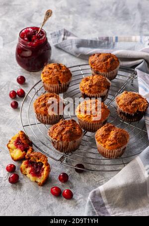 Homemade muffins with cranberry filling, on light background. Stock Photo