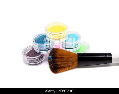 Glitter paint with brush isolated on white background Stock Photo