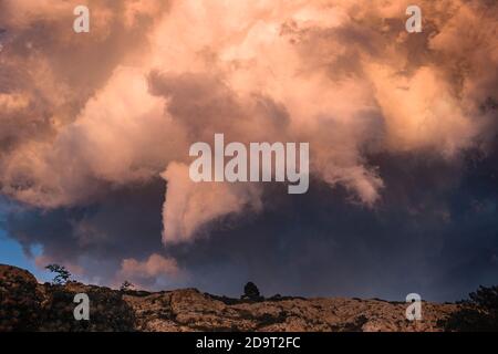 Storm Clouds Illuminated by Sunset Light Stock Photo
