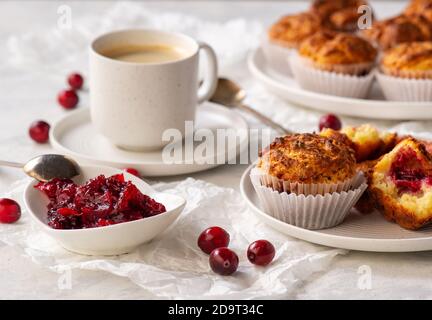 Homemade muffins with cranberry filling, on light background. Stock Photo
