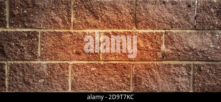 Old red gringe brick wall in a background image Stock Photo