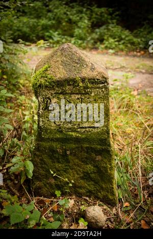 Old weathered stone marker milestone on Thruxton Village green engraved ...