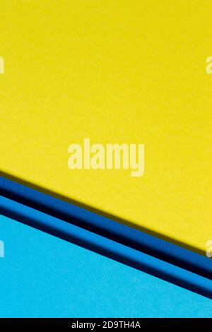 Abstract color papers geometry flat lay composition background with blue and yellow tones Stock Photo