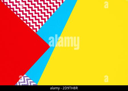 Abstract geometric fashion papers texture background in yellow, red, pink, blue colors. Top view, flat lay Stock Photo