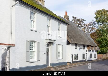 Period house and thatched cottage, High Street, Melbourn, Cambridgeshire, England, United Kingdom