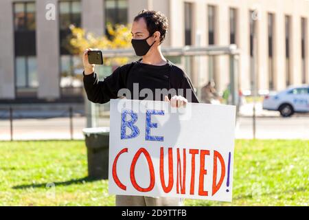 Washington DC, USA, 11/06/2020: After the elections, Anti-Trump Protesters make demonstrations near White House. A young man holds a banner that says Stock Photo