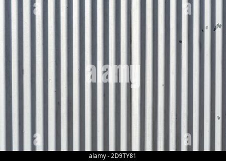 Corrugated metal exterior beaten by the weather.  Abstract background. Stock Photo