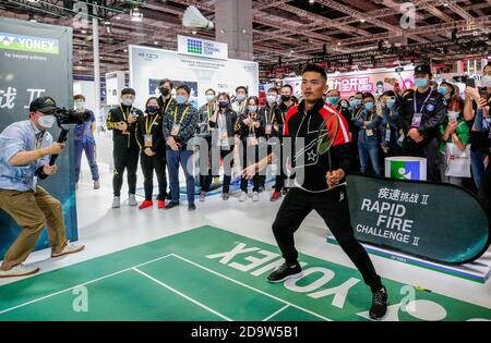 Beijing, China. 7th Nov, 2020. Chinese badminton star and double Olympic champion Lin Dan takes part in a 'rapid fire challenge' at the Yonex booth at the Consumer Goods exhibition area of the third China International Import Expo (CIIE) in Shanghai, east China, Nov. 7, 2020. Credit: Zhang Yuwei/Xinhua/Alamy Live News Stock Photo