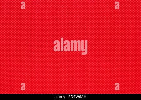 Background from red color texture of canvas non-woven fabric material in small rhombus. Close-up surface of blank bright abstract pattern backdrop, re Stock Photo