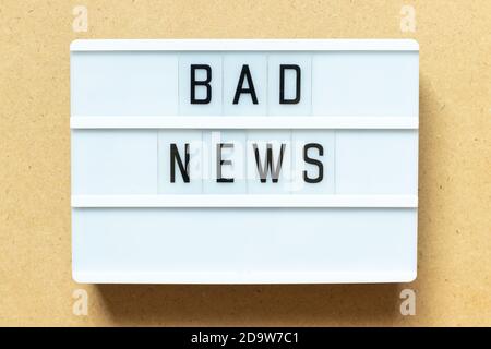 Lightbox with word bad news on wood background Stock Photo