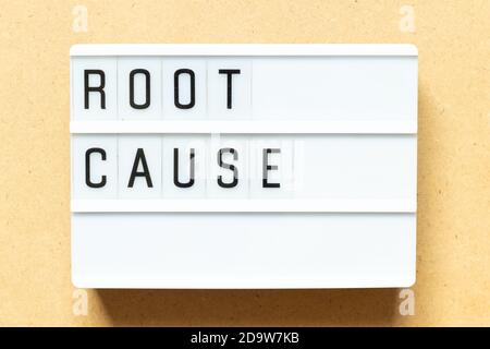 Lightbox with word root cause on wood background Stock Photo