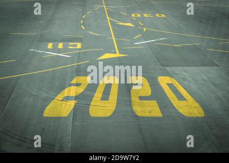 The 2020 number sign on the airport runway shows the coming New Year's reception soon. Stock Photo