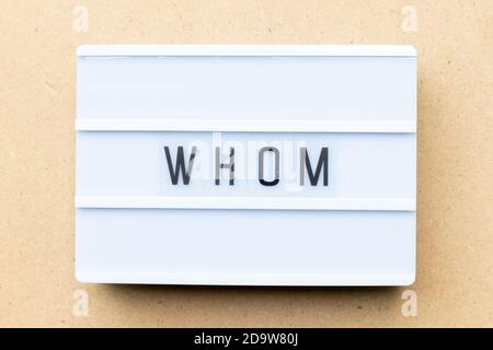 White lightbox with word whom on wood background Stock Photo