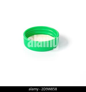 Green plastic bottle cap isolated on white background. Stock Photo