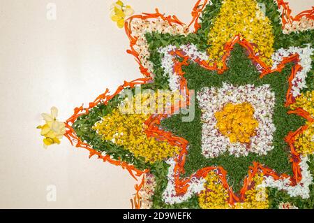 flower decoration on the floor made during onam celebrations in Kerala. Also known as pookalam in malayalam. Stock Photo