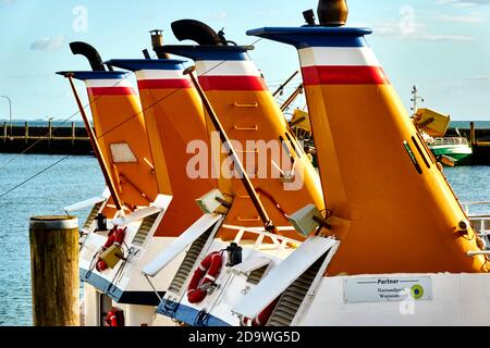 Sylt, Germany, September 4., 2020: Yellow chimneys for the exhaust gases of a passenger ship in the port of Hoernum on Sylt Stock Photo