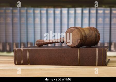 Judges gavel on law books with library background. Concept of legal education,law,legal, law cases, law study. Stock Photo