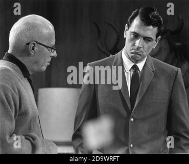 Director HOWARD HAWKS and ROCK HUDSON on set candid during filming of MAN'S FAVORITE SPORT ? 1964 director HOWARD HAWKS Gibraltar Productions / Laurel Productions / Universal Pictures Stock Photo