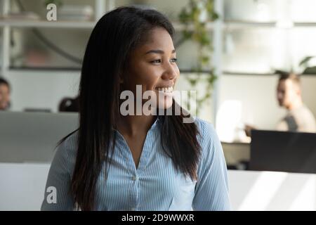 Smiling asian woman executive sitting at office resting from work Stock Photo