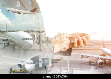 Double exposure of businessman using smart phone on the airport runway background. Stock Photo