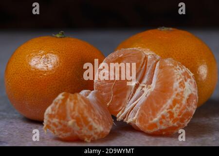 Juicy mandarins on dark background Stock Photo