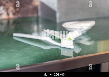 Toothbrush, toothpaste and the soap placed in front of the mirror in the bathroom. Stock Photo