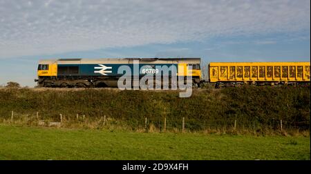 GBRf class 66 diesel locomotive No. 66789 'British Rail 1948-1997' pulling a freight train, Warwickshire, UK Stock Photo