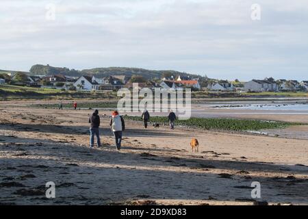 Maidens, South Ayrshire, Scotland, An picturesque harbour on the West coast of Scotland in the Firth of Clyde. UK Harbour. A seawall projects offering shelter from the sea .People out enjoying the fresh air and beach Stock Photo