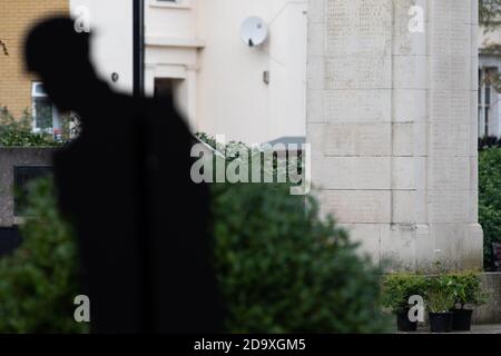 London, UK. 8th November, 2020. The local community holds a small, social distanced wreath-laying event at the War Memorial next to Brentford Library. Credit: Liam Asman/Alamy Live News Stock Photo