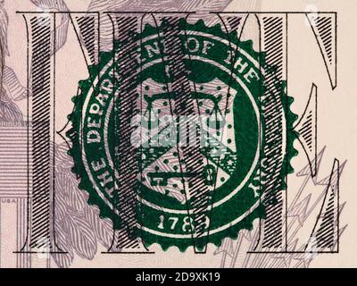 U.S. Treasury Seal on 5 dollar bill extreme macro, united states money closeup Stock Photo