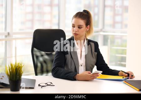Thoughtful worried european business woman looking away, thinking, solving a problem at work, worried entrepreneur Stock Photo