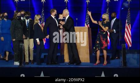 In this image from the Biden Campaign video feed, United States President-elect Joe Biden on stage with his family including son Hunter and wife Jill after he made remarks to the nation after being declared the victor of the 2020 US presidential election from the Chase Center in Wilmington, Delaware on Saturday, November 7, 2020.Credit: Biden Campaign via CNP /MediaPunch Stock Photo