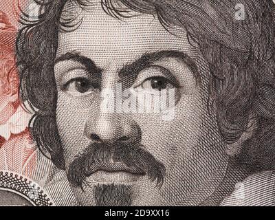 Caravaggio portrait on 100000 italian lire banknote closeup macro. One of the greatest and innovative painter of the Renaissance. Stock Photo