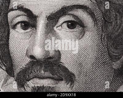 Caravaggio portrait on 100000 italian lire banknote closeup macro. One of the greatest and innovative painter of the Renaissance. Stock Photo