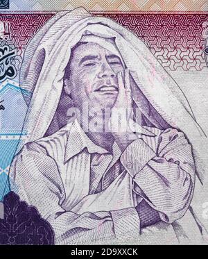 Muammar Gaddafi portrait on Libya 1 dinar (2009) banknote close up macro, Libyan money closeup Stock Photo