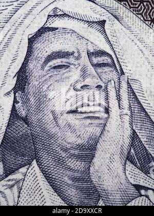 Muammar Gaddafi portrait on Libya 1 dinar (2009) banknote close up macro, Libyan money closeup Stock Photo