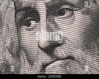 Marco Polo portrait on Italian 1000 Lire banknote close up macro. Famous traveler, explorer, discoverer, cartographer. Stock Photo