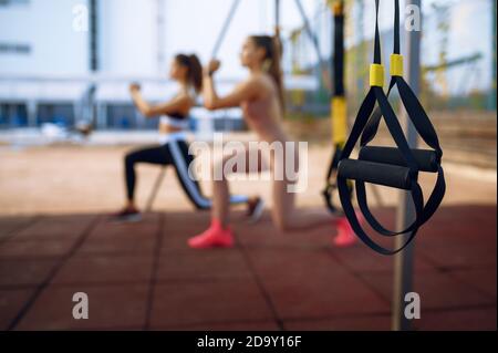 Women doing stretching exercise, group training Stock Photo