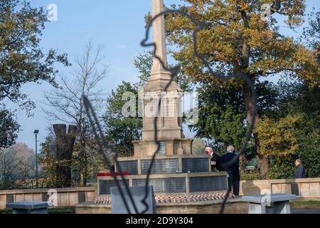 Brentwood Essex 8th November 2020 Impromptu gathering of the public and veterans at the Brentwood War Memorial for the Act of Rememberance as the Council wreaths arrive. Credit: Ian Davidson/Alamy Live News Stock Photo