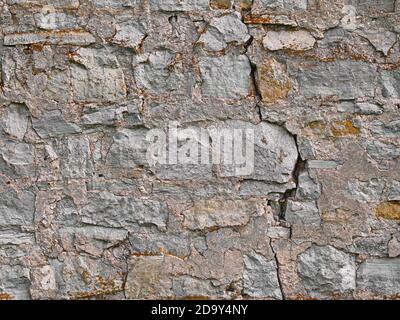 Old brick stone wall background, rural limestone stonewall texture Stock Photo