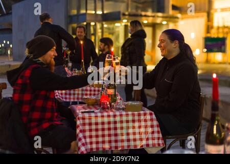 Chez Jules restaurant owner Pierre Levicky and staff serve couples a candle lit dinner in front of the Scottish parliament. This is highlight the ongoing troubles of restaurants which in Edinburgh are under tier 3 and unable to sell alcohol with the food, this is on top of reduced opening hours for food.  Credit: Euan Cherry Stock Photo